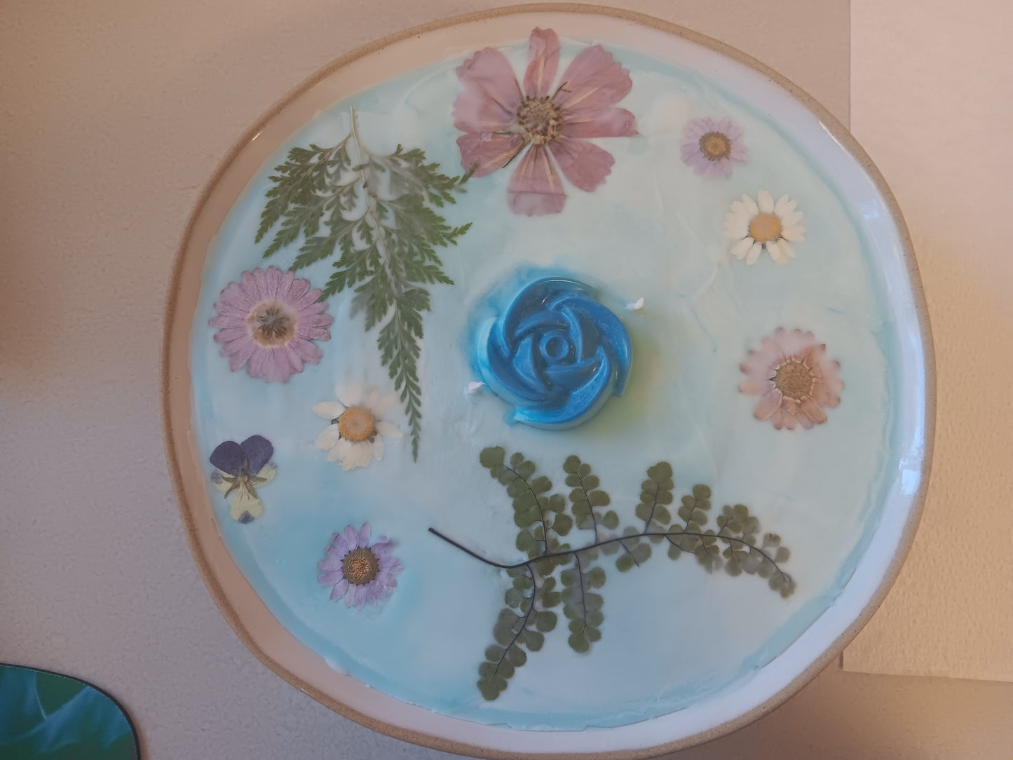 Teal candle in porcelain bowl